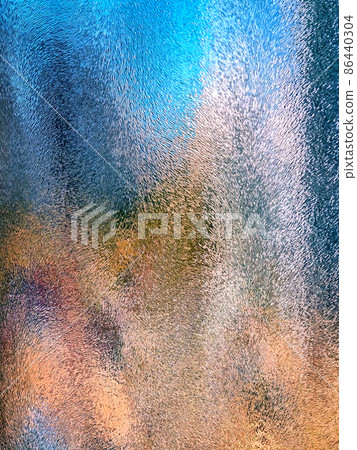 Beautiful, bright, unusual background created by abstract patterns, formed by multi-colored lighting of the embossed glass surface Beautiful, bright, unusual background created by abstract patterns, formed by multi-colored lighting of the embossed glass surface 86440304