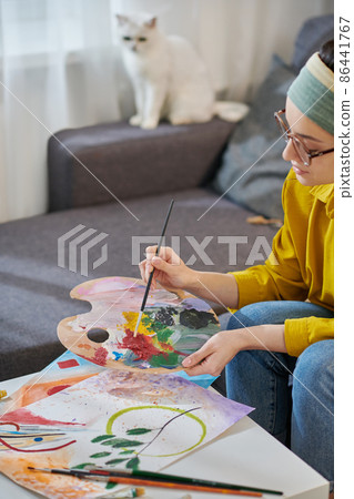 A female artist working in the studio A female artist working in the studio 86441767