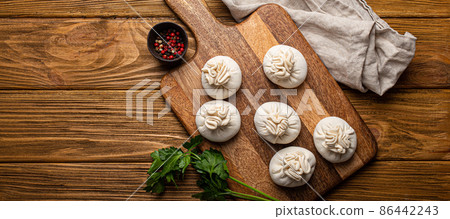 Raw freshly made Khinkali, traditional dish of Georgian Caucasian cuisine, dumplings 86442243