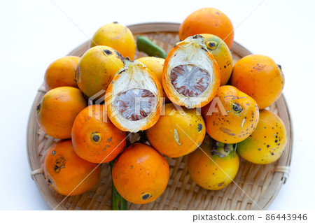 Betel nut in bamboo basket 86443946