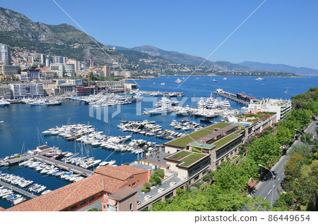 Rich yachts in the bay at day time. 86449654