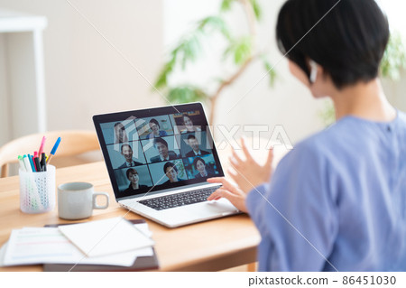 Woman having an online meeting with remote work Woman having an online meeting with remote work 86451030