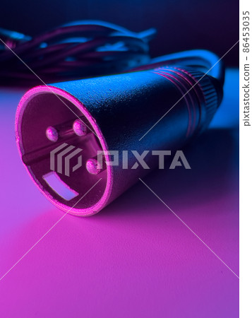 XLR Cable and plug in a macro shot XLR Cable and plug in a macro shot 86453035