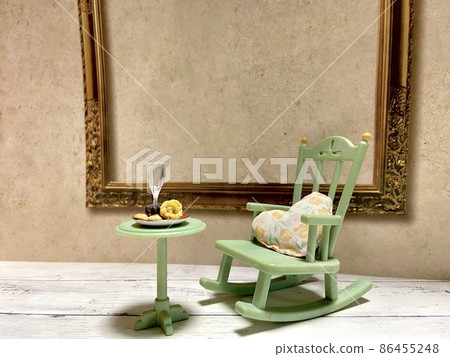 Tea time in a miniature hanging chair Tea time in a miniature hanging chair 86455248