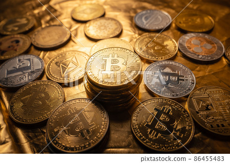 Cryptocurrency  coin and bitcoin on golden background 86455483