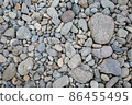 Riverbank gravel, stone and rock patterns, natural background material 86455495
