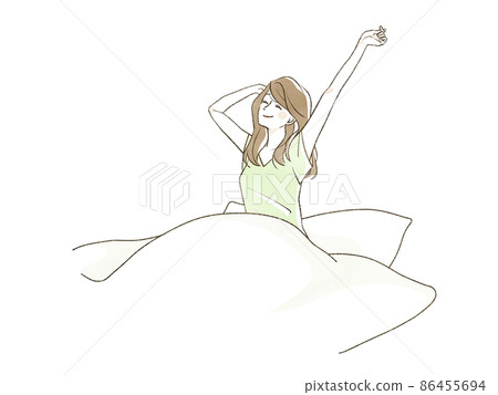 A woman stretching her body in a futon A woman stretching her body in a futon 86455694