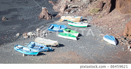 Green Lagoon at El Golfo with fishing boats on the beach, Lanzarote Green Lagoon at El Golfo with fishing boats on the beach, Lanzarote 86459621