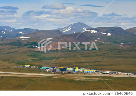 Summer aerial view of the air town and the runway of the arctic airfield 86460646