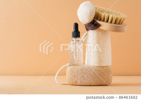 Facial cosmetic products and eco friendly bathroom accessories on beige background. Beauty, sustainable and wellness concept Facial cosmetic products and eco friendly bathroom accessories on beige background. Beauty, sustainable and wellness concept 86461682
