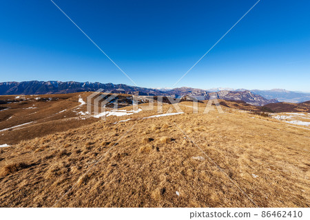 Lessinia Plateau with the Mountain Range of Monte Baldo and Adamello Brenta Lessinia Plateau with the Mountain Range of Monte Baldo and Adamello Brenta 86462410