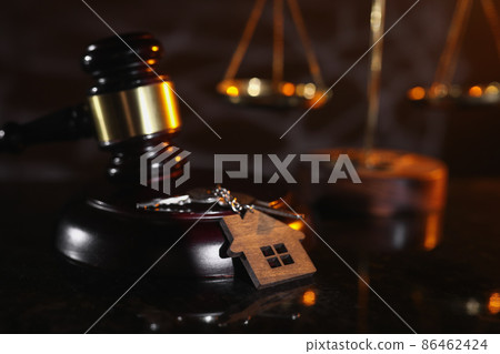 Auction or law concept. House key and judge gavel in notary office 86462424