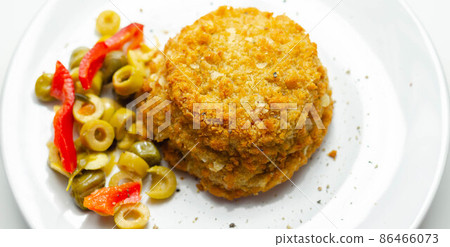 Cod and prawns red Thai style fish cake served with pickled olives, gherkin, garlic, and red peppers 86466073