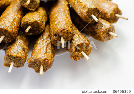 Minced and shaped lamb kebabs with chilli and coriander prepared for grill Minced and shaped lamb kebabs with chilli and coriander prepared for grill 86466399