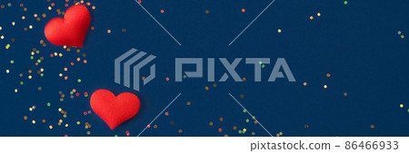 Festive banner background with red hearts and small multicolored holographic sparkles on dark blue background. St.Valentines day background for your project Festive banner background with red hearts and small multicolored holographic sparkles on dark blue background. St.Valentines day background for your project 86466933