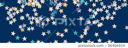 Festive background with holographic sparkling stars confetti on dark blue background. Christmas, New Year or birthday party background for your project. Banner Festive background with holographic sparkling stars confetti on dark blue background. Christmas, New Year or birthday party background for your project. Banner 86466934