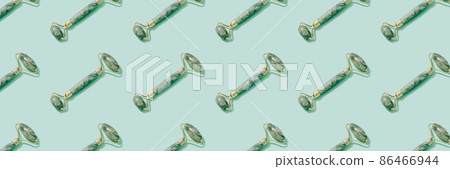 Banner pattern made of jade gua sha facial roller on pastel green background. Facial massage kit for lifting massage therapy made from natural stones, personal skin care anti-aging tools 86466944