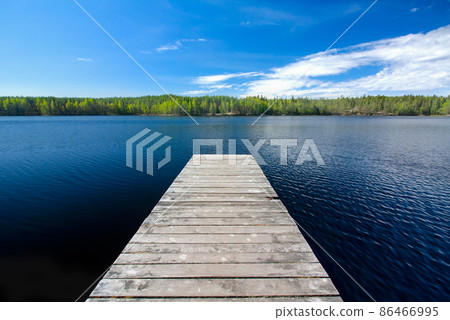 Wooden pier on beautiful lake in the national park Repovesi, Finland, South Karelia. 86466995