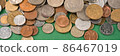 Banner. Collection of old coins on dark green background with copy space. Various vintage coins from worldwide as background. Financial growth and business concept. Numismatics and coins collecting 86467019