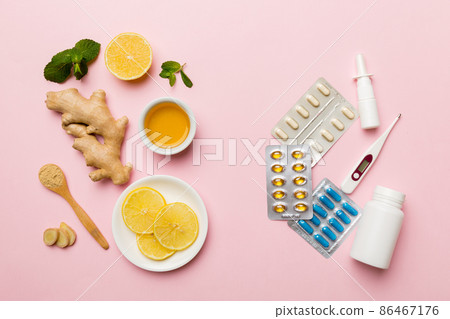 Natural cold and flu home remedies. Natural ingredients for immunity stimulation and viruses protection. top view flat lay Natural cold and flu home remedies. Natural ingredients for immunity stimulation and viruses protection. top view flat lay 86467176