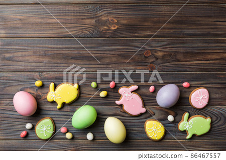 holiday preparation Multi colors Easter eggs with cookies on colored background . Pastel color Easter eggs. holiday concept with copy space 86467557