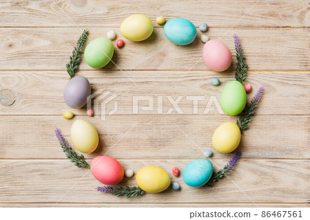 round frame Multi colors Easter eggs on colored background . Pastel color Easter eggs holiday concept with empty space for you design 86467561