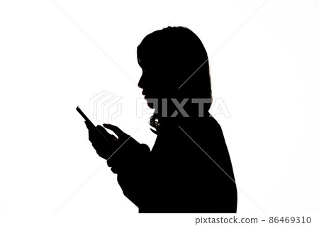 Young female smartphone silhouette Young female smartphone silhouette 86469310