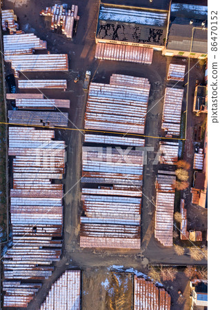 Brickyard aerial. Brick factory with piles of stacked bricks 86470152