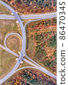 Aerial view on a circular road intersection 86470345