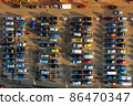 Aerial of a parking lot near supermarket 86470347