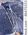 Aerial view on a frozen pond covered in ice 86470353