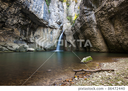 The Momin Skok waterfall near Emen in Bulgaria - autumn landscape 86472440