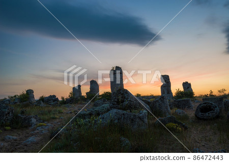 Beautyful sunrise over The Stone Desert Pobiti Kamani - fabulous rock phenomenon in Varna Province, Bulgaria - tourist destination Beautyful sunrise over The Stone Desert Pobiti Kamani - fabulous rock phenomenon in Varna Province, Bulgaria - tourist destination 86472443