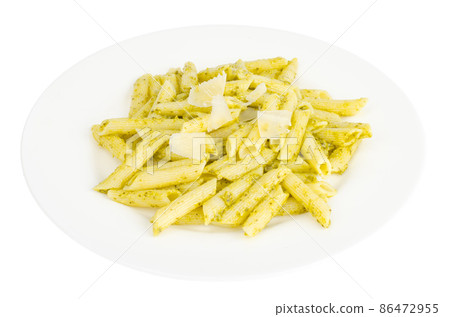 White plate with pasta and pesto White plate with pasta and pesto 86472955