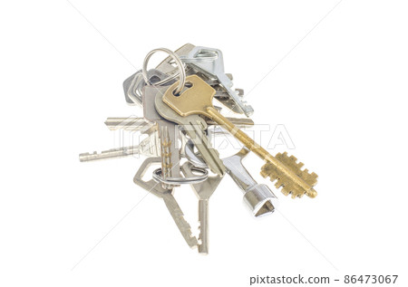Bundles of old keys on white background. Bundles of old keys on white background. 86473067