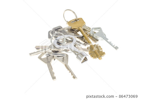 Bundles of old keys on white background. Bundles of old keys on white background. 86473069