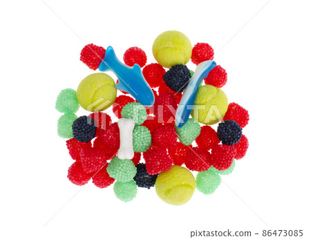Sweet chewy color candies isolated on white background. 86473085