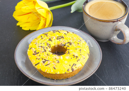 Cup of espresso with fresh pastries for breakfast on black stone background. Cup of espresso with fresh pastries for breakfast on black stone background. 86473240