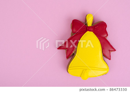 Homemade gingerbread with icing in shape of bells. Homemade gingerbread with icing in shape of bells. 86473330