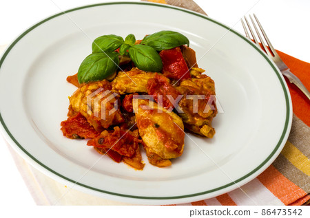 Chicken breast fillet braised with vegetables, paprika. 86473542