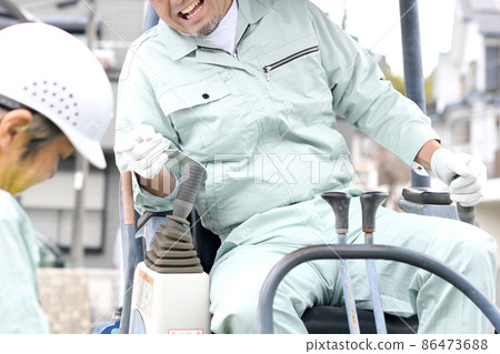 A man who is a site supervisor who gets angry with workers at a construction site A man who is a site supervisor who gets angry with workers at a construction site 86473688