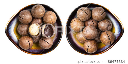 set of macadamia nuts in ceramic bowls isolated 86475884