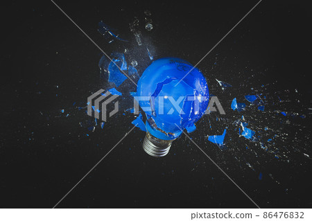 blue light bulb exploding on black. blue light bulb exploding on black. 86476832