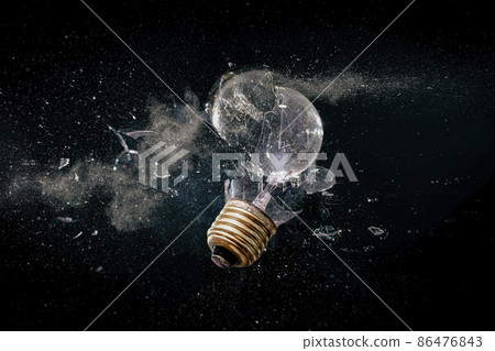 destruction of a light bulb on black. destruction of a light bulb on black. 86476843