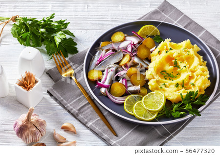 sprat red onion and pickles salad with potato mash sprat red onion and pickles salad with potato mash 86477320
