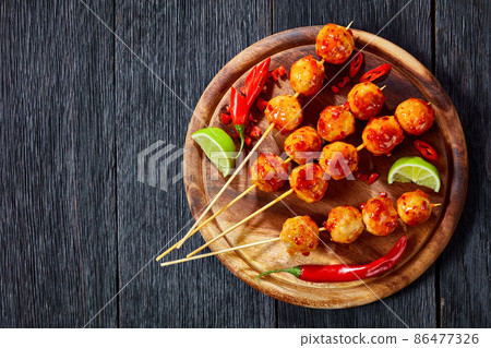 Luk Chin Ping, thai meatball skewers, top view Luk Chin Ping, thai meatball skewers, top view 86477326