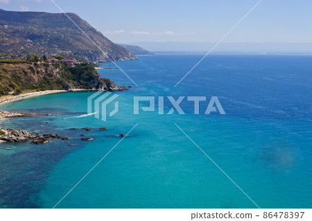 Amazing tropical panoramic view of turquoise gulf bay, sandy beach, green mountains. Amazing tropical panoramic view of turquoise gulf bay, sandy beach, green mountains. 86478397