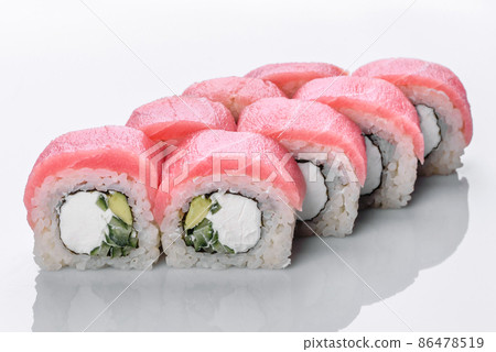 Traditional delicious fresh sushi roll set on a white background Traditional delicious fresh sushi roll set on a white background 86478519