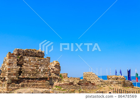 Ancient fortress wall at the entrance of the old town of Nessebar in Bulgaria Ancient fortress wall at the entrance of the old town of Nessebar in Bulgaria 86478569