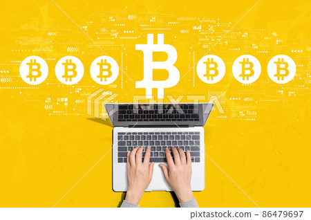 Bitcoin theme with person using laptop Bitcoin theme with person using laptop 86479697